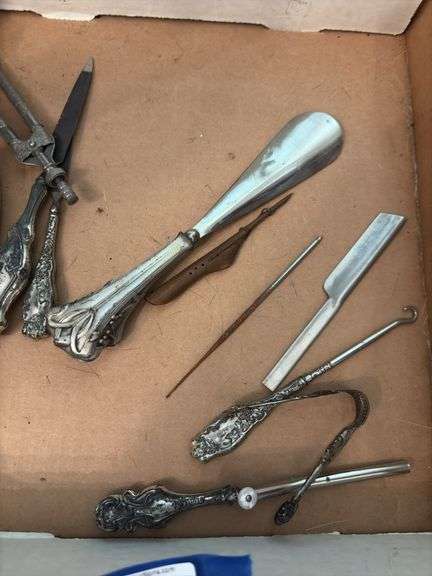 Sterling handled implements including: nail file and buffer, shoehorn, button hooks, letter opener, curling iron