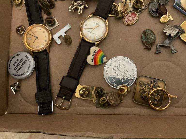 Wrist watches by Gervais Penard, Timex, truck belt buckle, lapel pins, misc