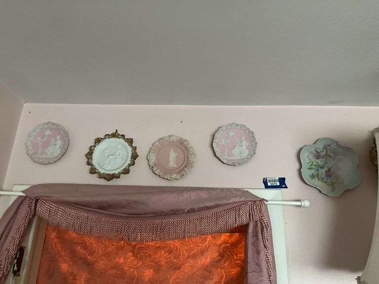 Wall hangings: milk glass Cupid & Psyche plate, bisque plaques, handpainted porcelain plates, two framed needlepoints