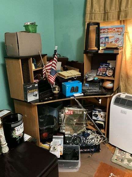 Corner desk and contents: desk accessoroies, CDs, brief cases, cables, misc