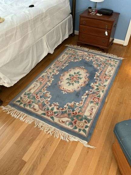 Two floral rugs w/ blue grounds - 42x73, 23x66