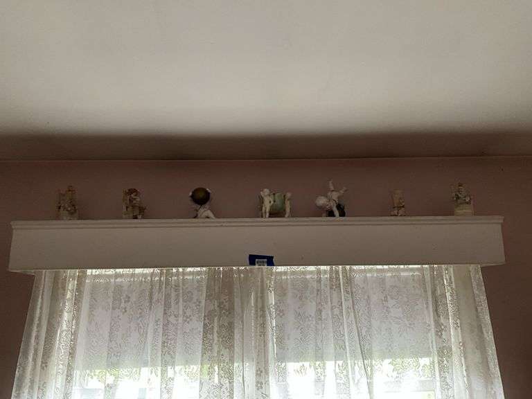 Contents of window cornice: bisque figurines, glazed planter