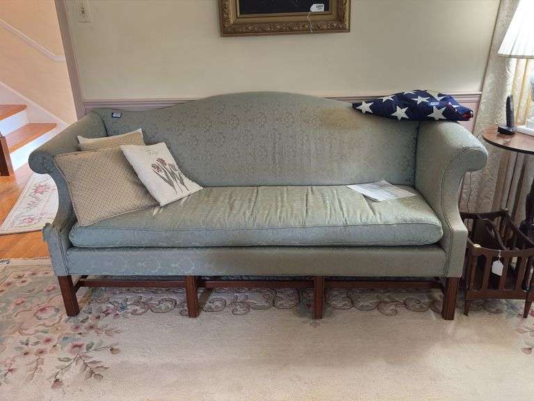 Camel back sofa and throw pillows - note upholstery shows wear - flag not included 72in long