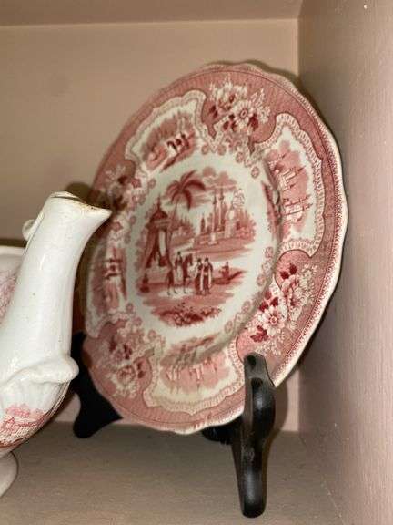 Contents of shelf: red Staffordshire transfer printed china teapot, sugar & creamer, plates