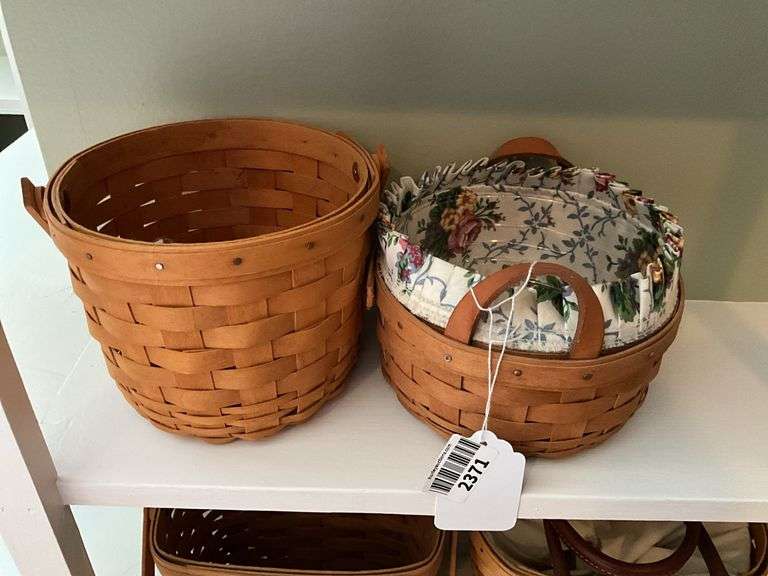 Two Longaberger baskets, one has fabric lining