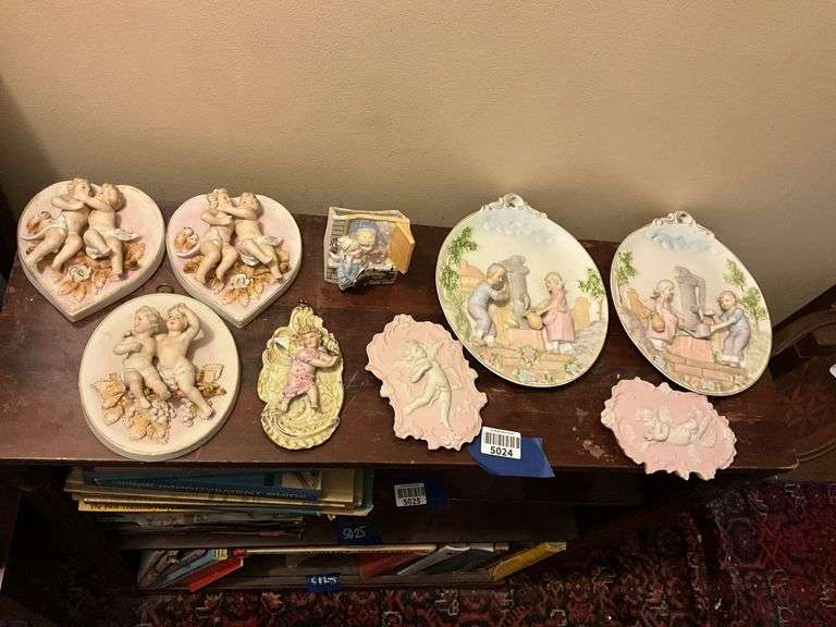 Collection of bisque plaques w/ cherubs and children in relief, and bisque match pocket