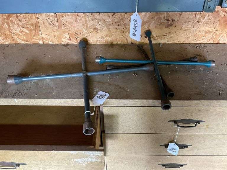 Three 4-way lug wrenches