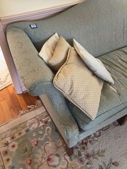 Camel back sofa and throw pillows - note upholstery shows wear - flag not included 72in long