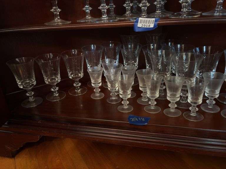 Contents of two shelves: glass stemware set