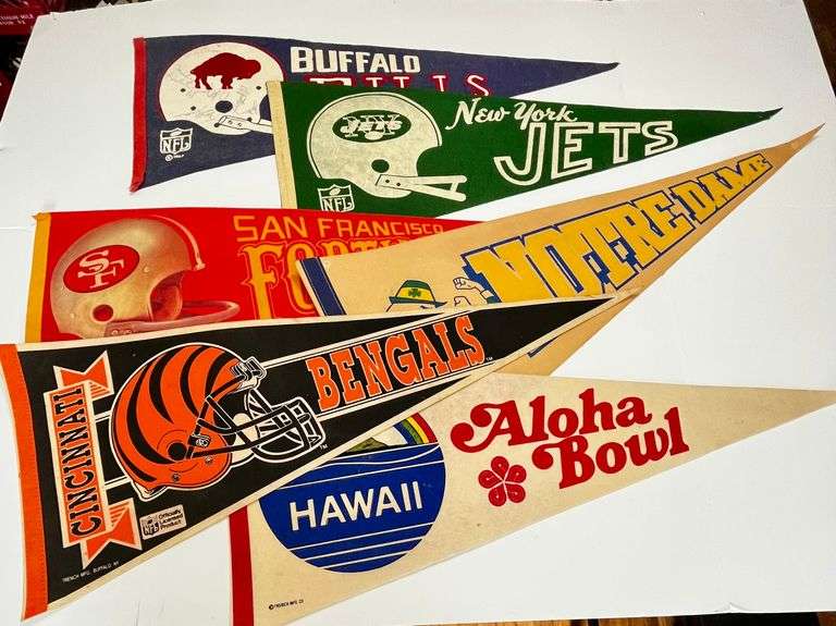 Six pennants: Buffalo Bills (autographed), Forty-Niners, Jets, Bengals, Notre dame, Aloha bowl
