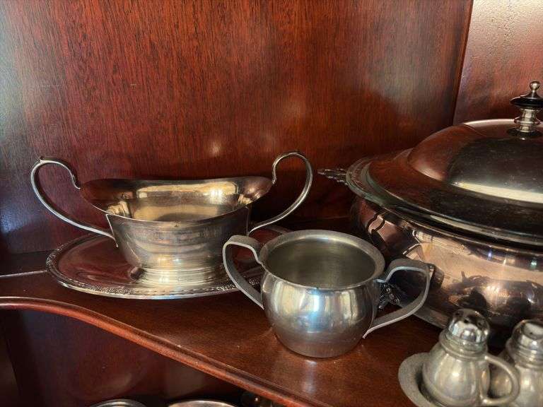 Contents of shelf: pewter serving pcs