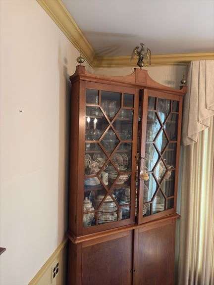 Federal style corner cupboard w/ central eagle finial, glazed top doors over cupboard base, inlaid stringing, French bracket feet - no contents 43x23x94 MUST COME DURING LAST 2 HOURS OF PICKUP FOR THIS ITEM