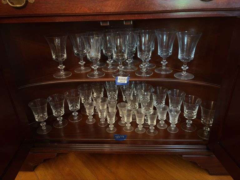 Contents of two shelves: glass stemware set
