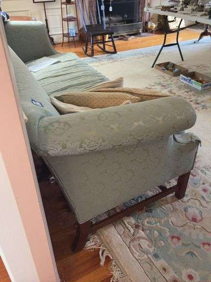 Camel back sofa and throw pillows - note upholstery shows wear - flag not included 72in long