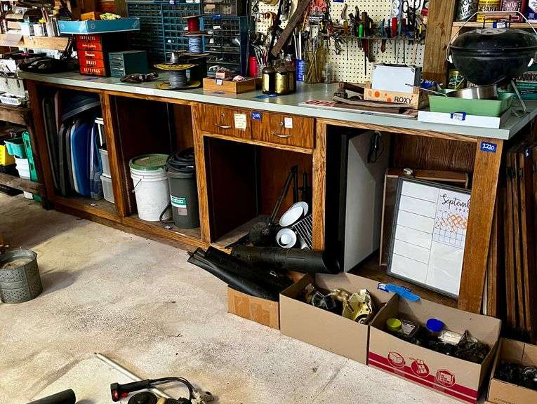 Large workbench (11ft) with doors and shelves, no contents, ***MUST come during last 2 hours of picked up to retrieve this item.