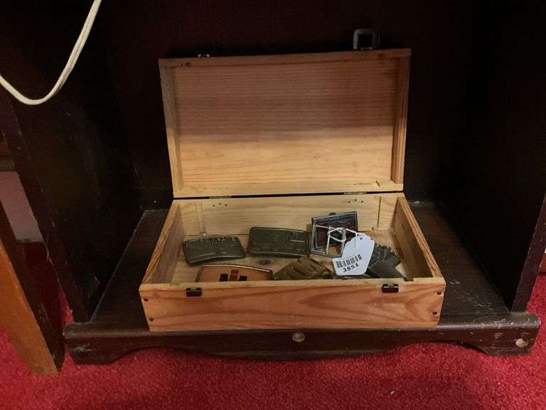 Trucker and other belt buckles in wooden box