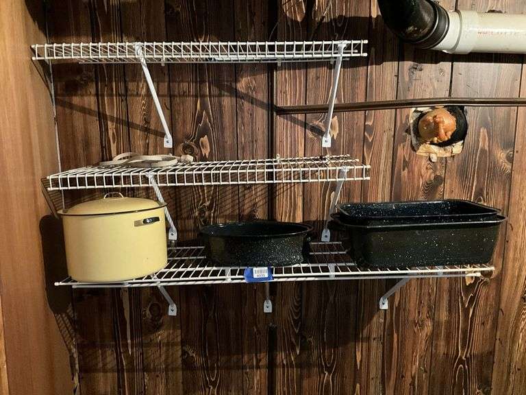 Contents of shelf: enamel roasters and pot