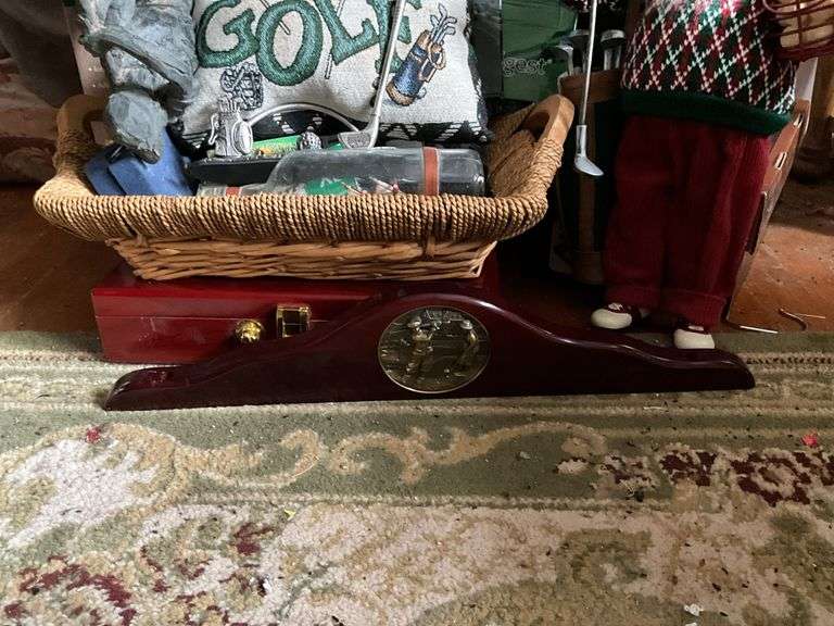 Golf clubs in bag, golfing Santa figure, golf accessories and decor items