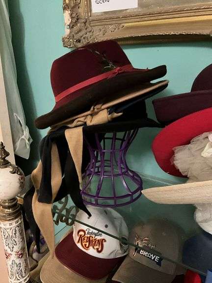 Contents of three shelves: ladies hats and purses, baseball caps,