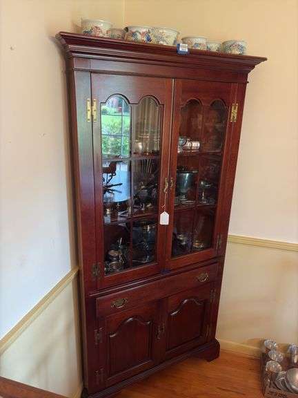 Mahogany corner cupboard w/ molded cornice over glazed doors, drawer and cupboard base, w/ bracket feet - no contents 34.25x17x72 MUST COME DURING LAST 2 HOURS OF PICKUP FOR THIS ITEM