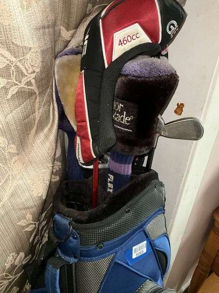Golf clubs in bag, golfing Santa figure, golf accessories and decor items