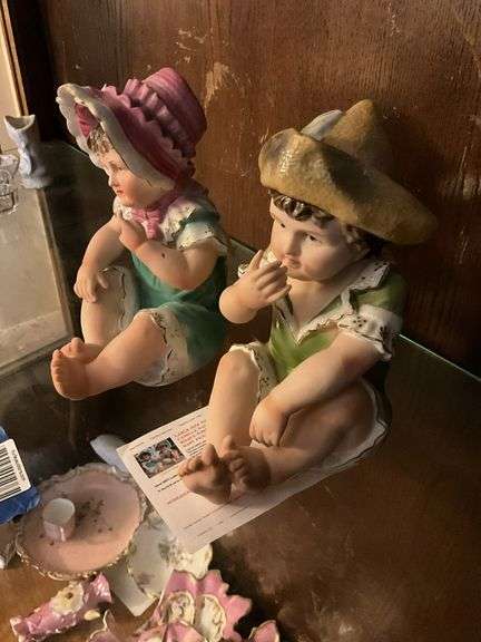 Two bisque piano baby figurines