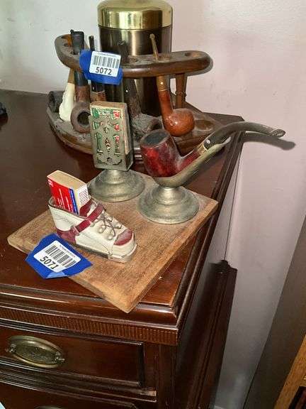 Smoking stand w/ pipe rest, matchbox holder and child's shoe, on wooden base