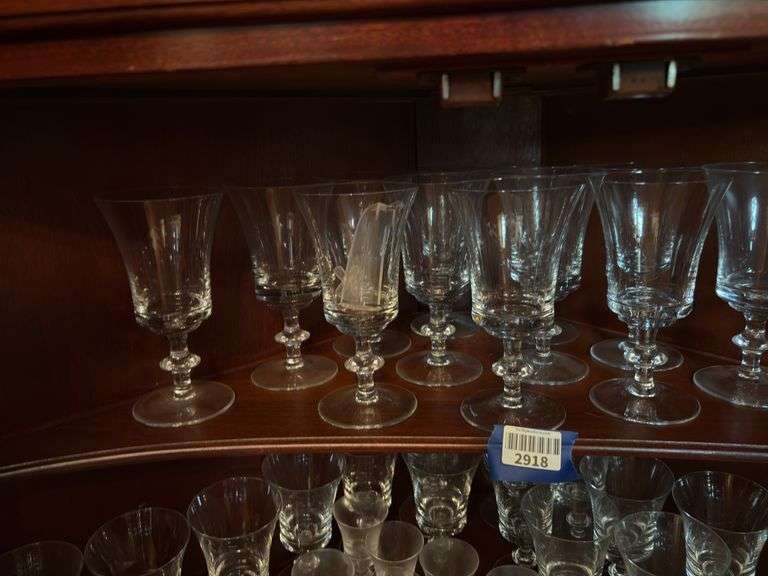 Contents of two shelves: glass stemware set