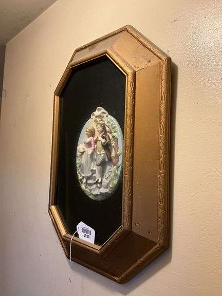 China plaque w/ couple in relief set in gilt frame 24x18
