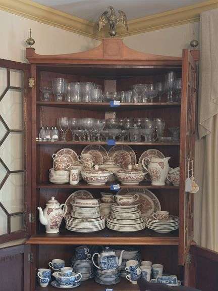 Federal style corner cupboard w/ central eagle finial, glazed top doors over cupboard base, inlaid stringing, French bracket feet - no contents 43x23x94 MUST COME DURING LAST 2 HOURS OF PICKUP FOR THIS ITEM