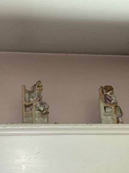 Contents of window cornice: bisque figurines, glazed planter