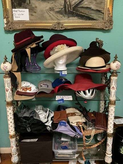 Contents of three shelves: ladies hats and purses, baseball caps,