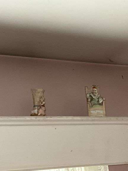 Contents of window cornice: bisque figurines, glazed planter