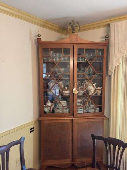 Federal style corner cupboard w/ central eagle finial, glazed top doors over cupboard base, inlaid stringing, French bracket feet - no contents 43x23x94 MUST COME DURING LAST 2 HOURS OF PICKUP FOR THIS ITEM