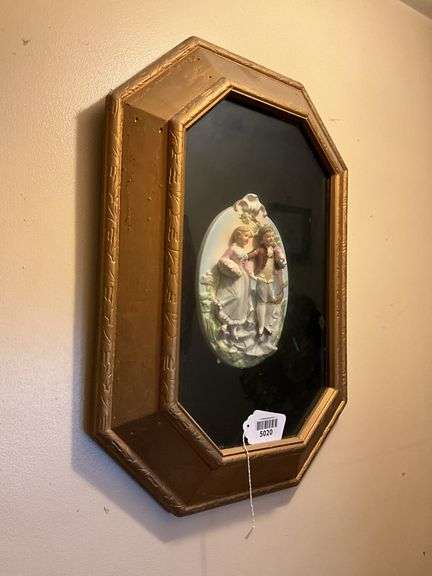 China plaque w/ couple in relief set in gilt frame 24x18