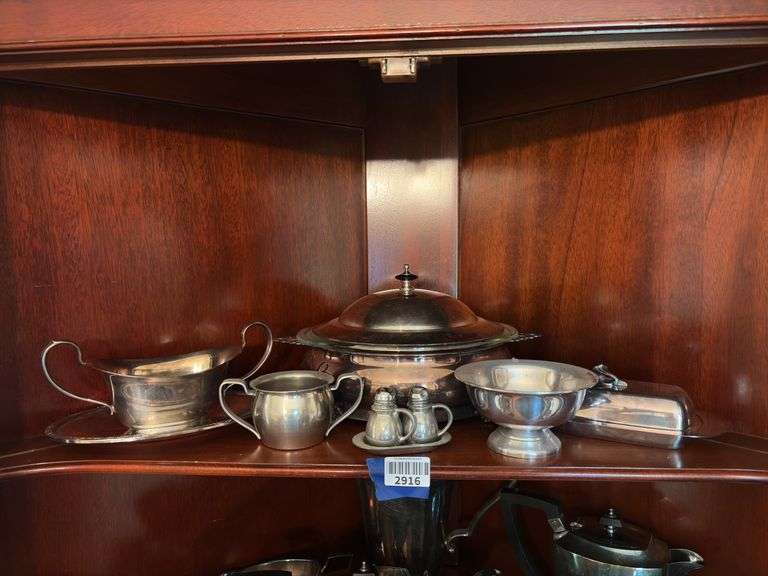 Contents of shelf: pewter serving pcs