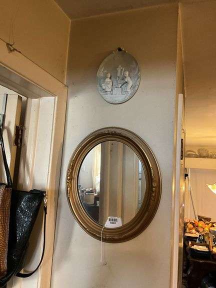 Wall hangings: oval gilt mirror 18x16, and bisque plaque w/ figures in relief