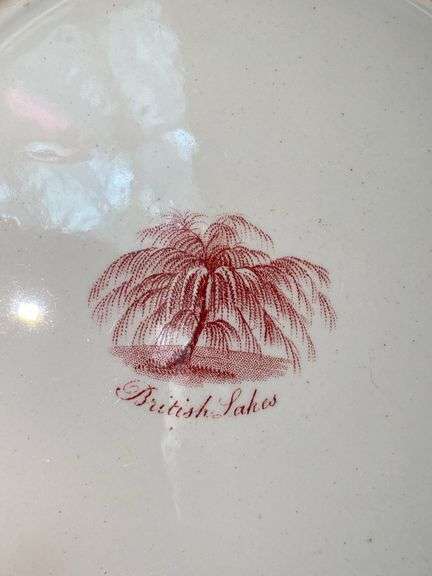 Contents of shelf: red Staffordshire transfer printed platter and plates, including British Lakes pattern
