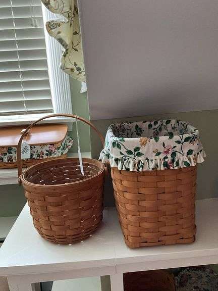 Two Longaberger baskets, one has fabric lining