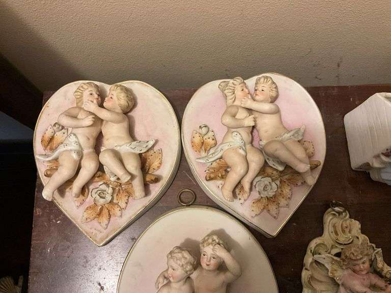 Collection of bisque plaques w/ cherubs and children in relief, and bisque match pocket