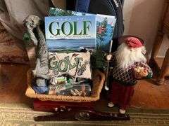 Golf clubs in bag, golfing Santa figure, golf accessories and decor items