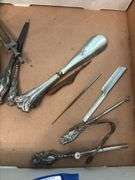 Sterling handled implements including: nail file and buffer, shoehorn, button hooks, letter opener, curling iron