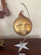 Man-in-the-Moon ornament on stand