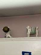 Contents of window cornice: bisque figurines, glazed planter