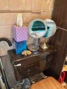 Contents of bathroom except fur coats: collectibles, health items, boots, cleaning supplies, misc