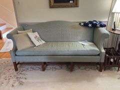 Camel back sofa and throw pillows - note upholstery shows wear - flag not included 72in long