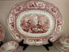Contents of shelf: red Staffordshire transfer printed china platter, plates, cup/saucer, including Caledonia pattern