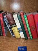 Book contents of four shelves: Bibles, golf, reference, misc