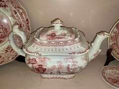 Contents of shelf: red Staffordshire transfer printed teapot, cup plates, plates