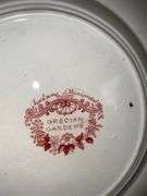 Contents of shelf: red Staffordshire transfer printed plates
